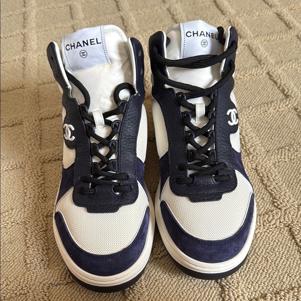 Chanel women’s Navy and White Sneakers
Size 9.5 Brand new